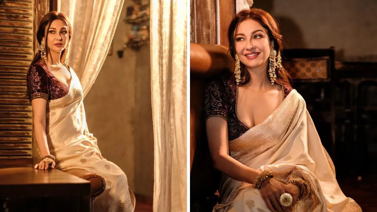 বেনাৰসী শাৰীবোৰ বেছিভাগ লোকে ভাল পায়। কিন্তু গধুৰ হোৱাৰ বাবে, মানুহে ইয়াক কেৱল অতি বিশেষ অনুষ্ঠানৰ পিন্ধনত অন্তৰ্ভুক্ত কৰে। ফটোখনত সৌম্য টণ্ডনে বগা ৰঙৰ বেনাৰসী শাৰী পিন্ধি আছে। যাৰ কাষত সোণালী কাম আছে আৰু সৰু বুট তৈয়াৰ কৰা হৈছে। এনে শাৰী পিন্ধাটো অত্যাধিক গধুৰ নহ'ব। একেলগে পিন্ধা কণ্ট্ৰাষ্ট ব্লাউজ আৰু কাশ্মীৰী ষ্টাইলৰ কাণফুলিবোৰ সুন্দৰ লুক প্ৰদান কৰিছে।
